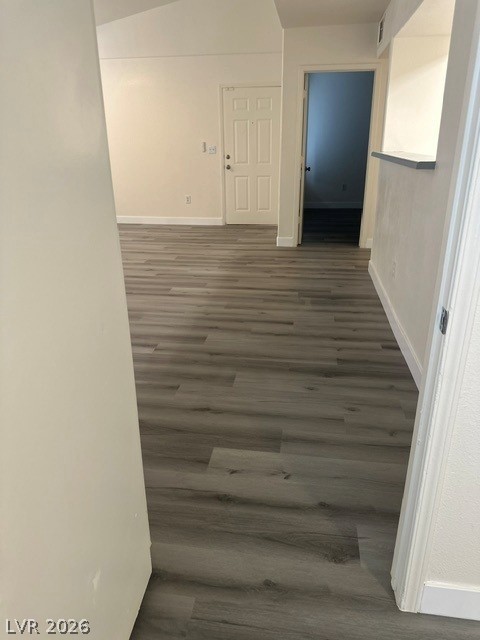 7255 West Sunset Road, Unit 2006 Las Vegas, NV 89113 - Photo 12 of 24 The open-concept layout features durable vinyl plank flooring and vaulted ceilings, creating an inviting atmosphere.