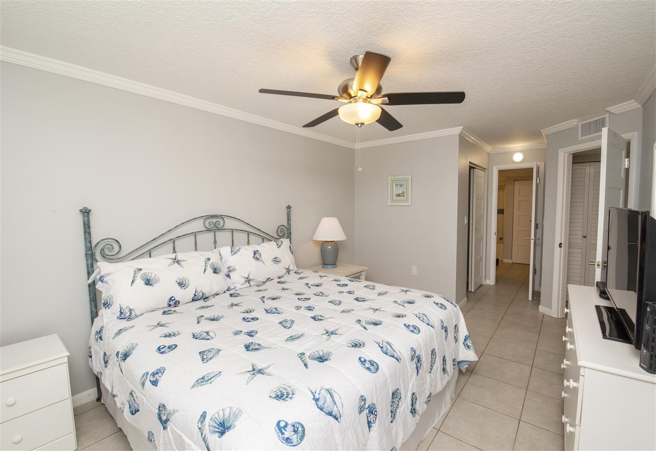 4250 A1A South, Unit A16 St. Augustine, FL 32080 - Photo 13 of 31 a bedroom with a bed and a view of bathroom