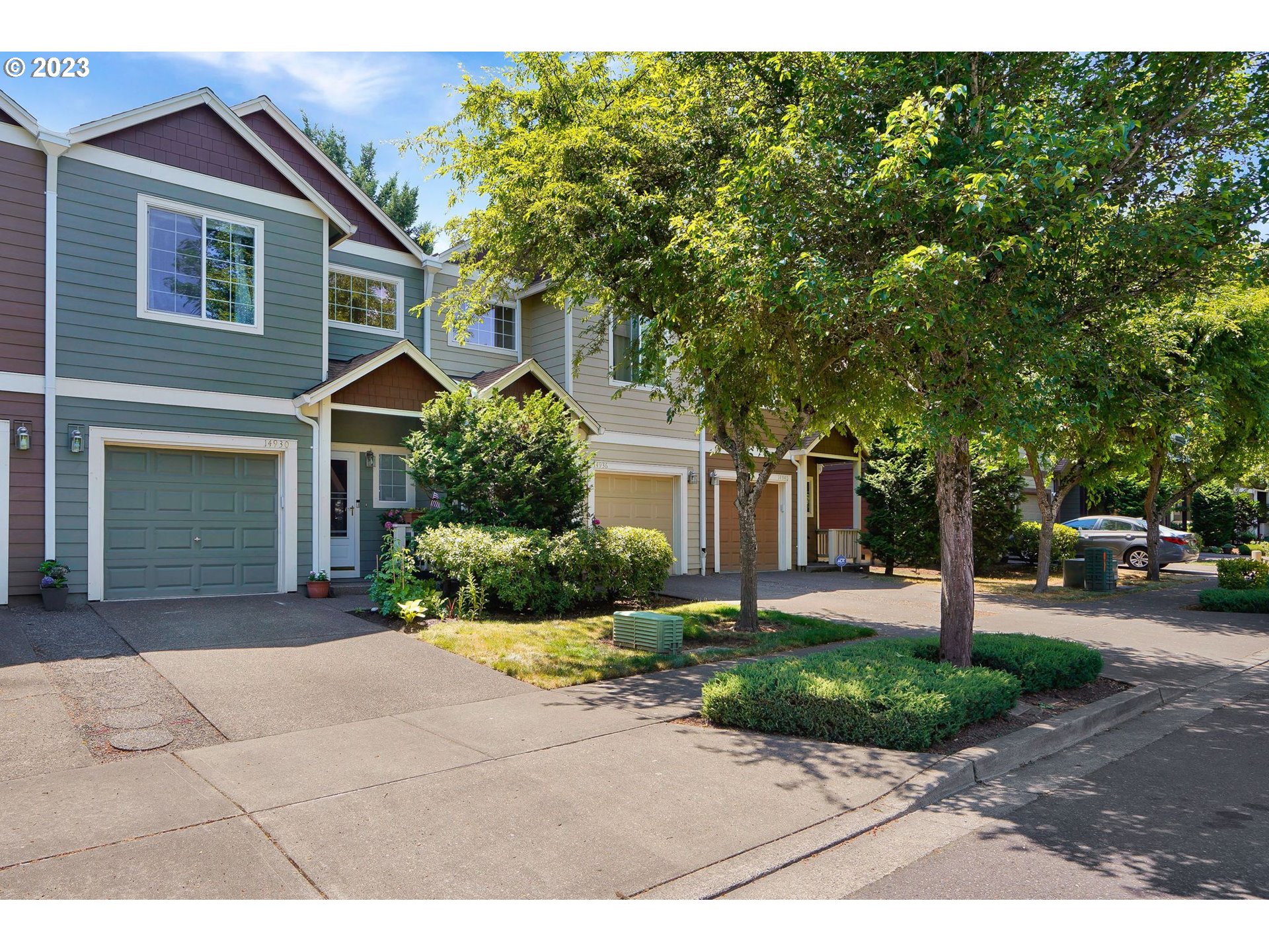 14930 Southwest Conor Circle Beaverton, OR 97006 - Photo 1 of 29 a front view of a house with a yard and garage