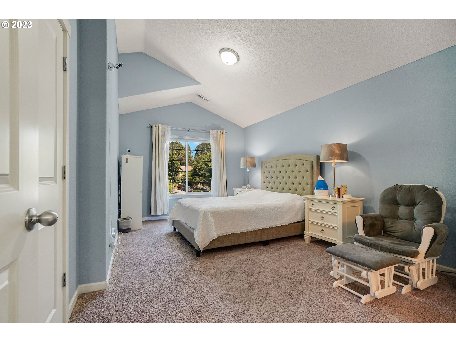 14930 Southwest Conor Circle Beaverton, OR 97006 - Photo 14 of 29 a bedroom with a bed and chair