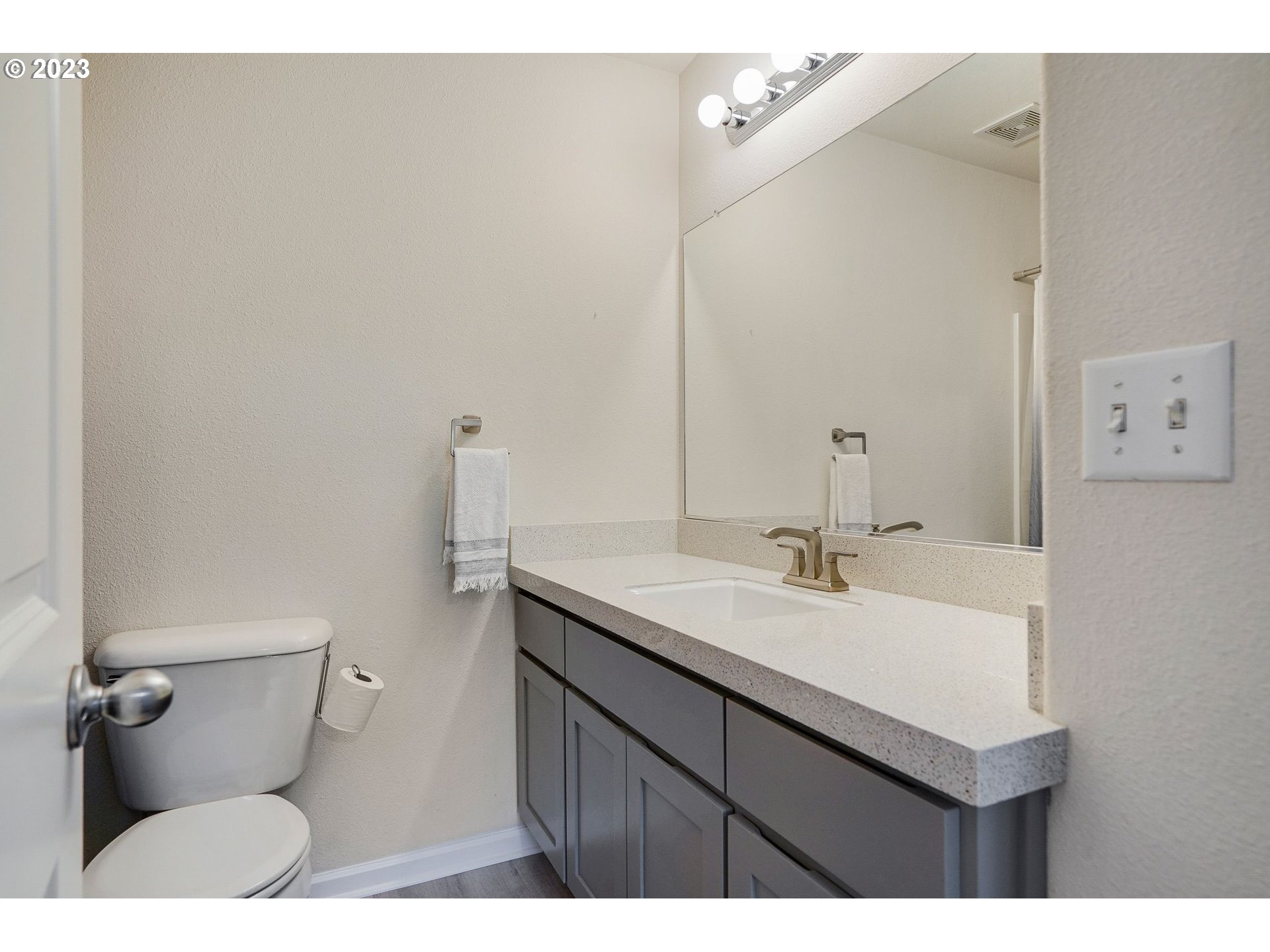 14930 Southwest Conor Circle Beaverton, OR 97006 - Photo 16 of 29 a bathroom with a sink mirror vanity and toilet