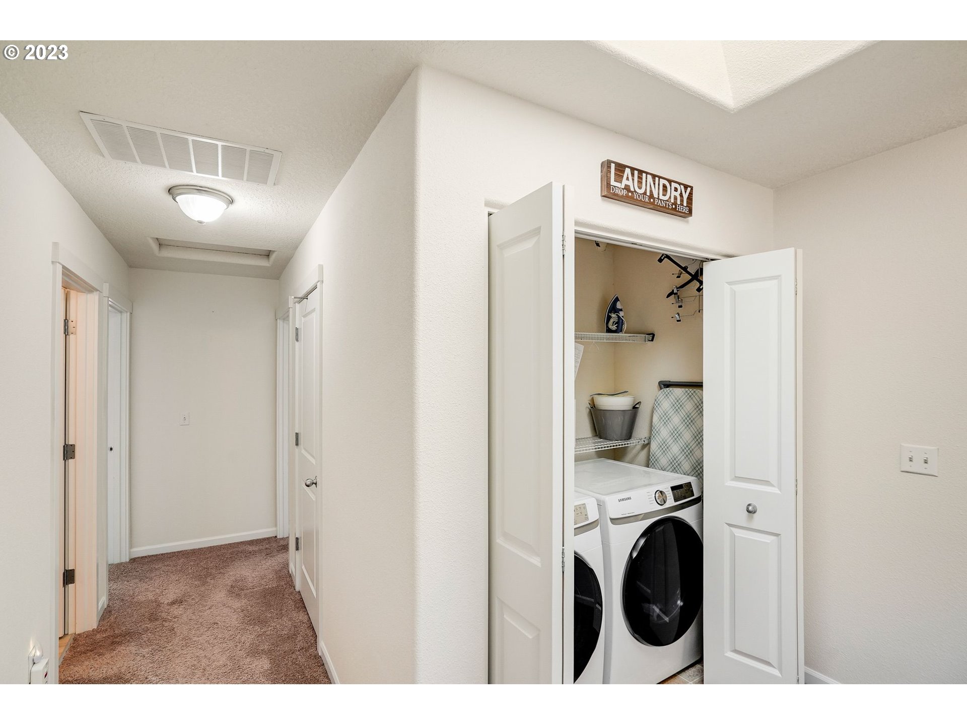 14930 Southwest Conor Circle Beaverton, OR 97006 - Photo 17 of 29 a view of a hallway with washer and dryer