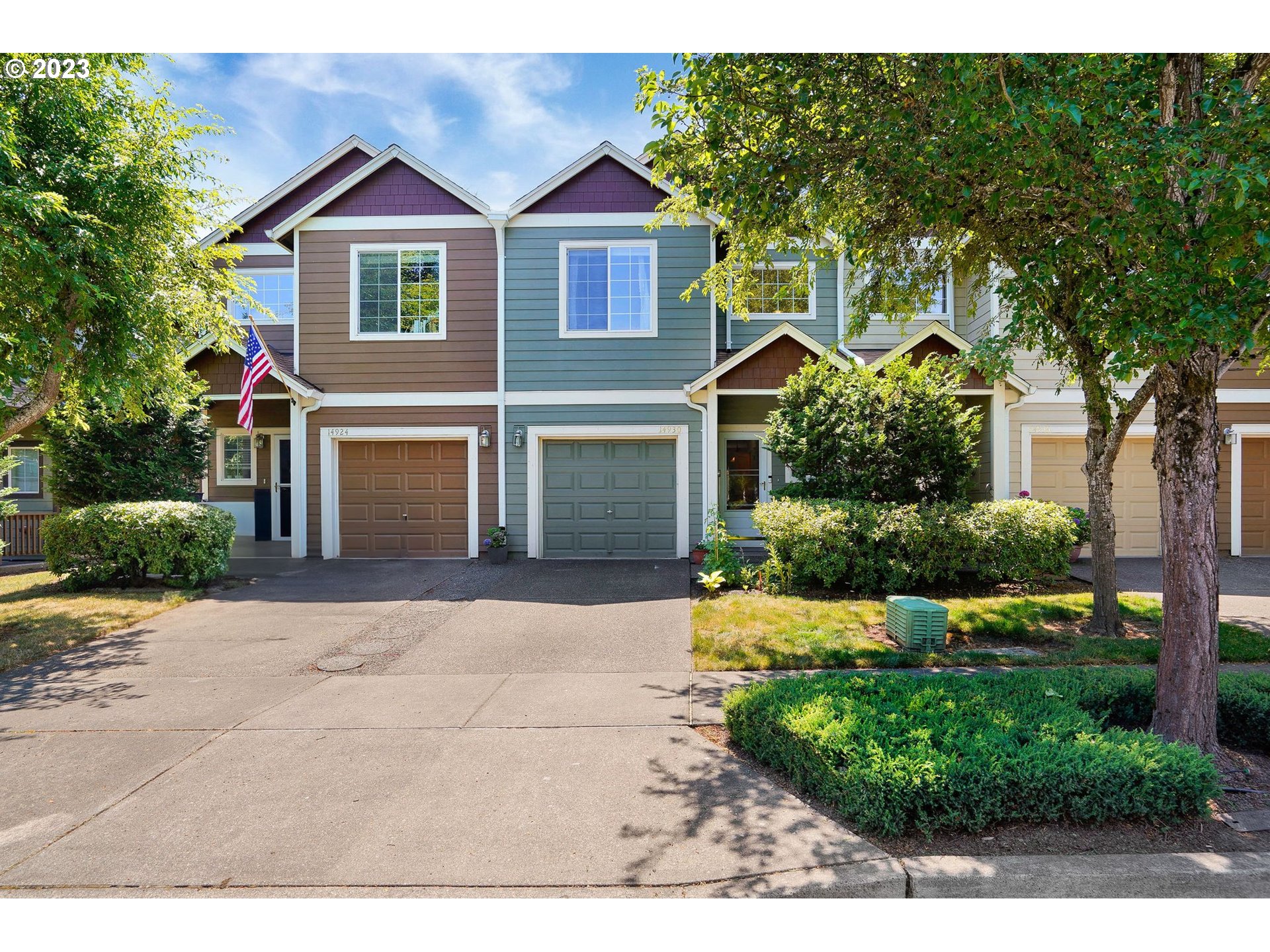 14930 Southwest Conor Circle Beaverton, OR 97006 - Photo 2 of 29 a front view of a house with a yard and garage