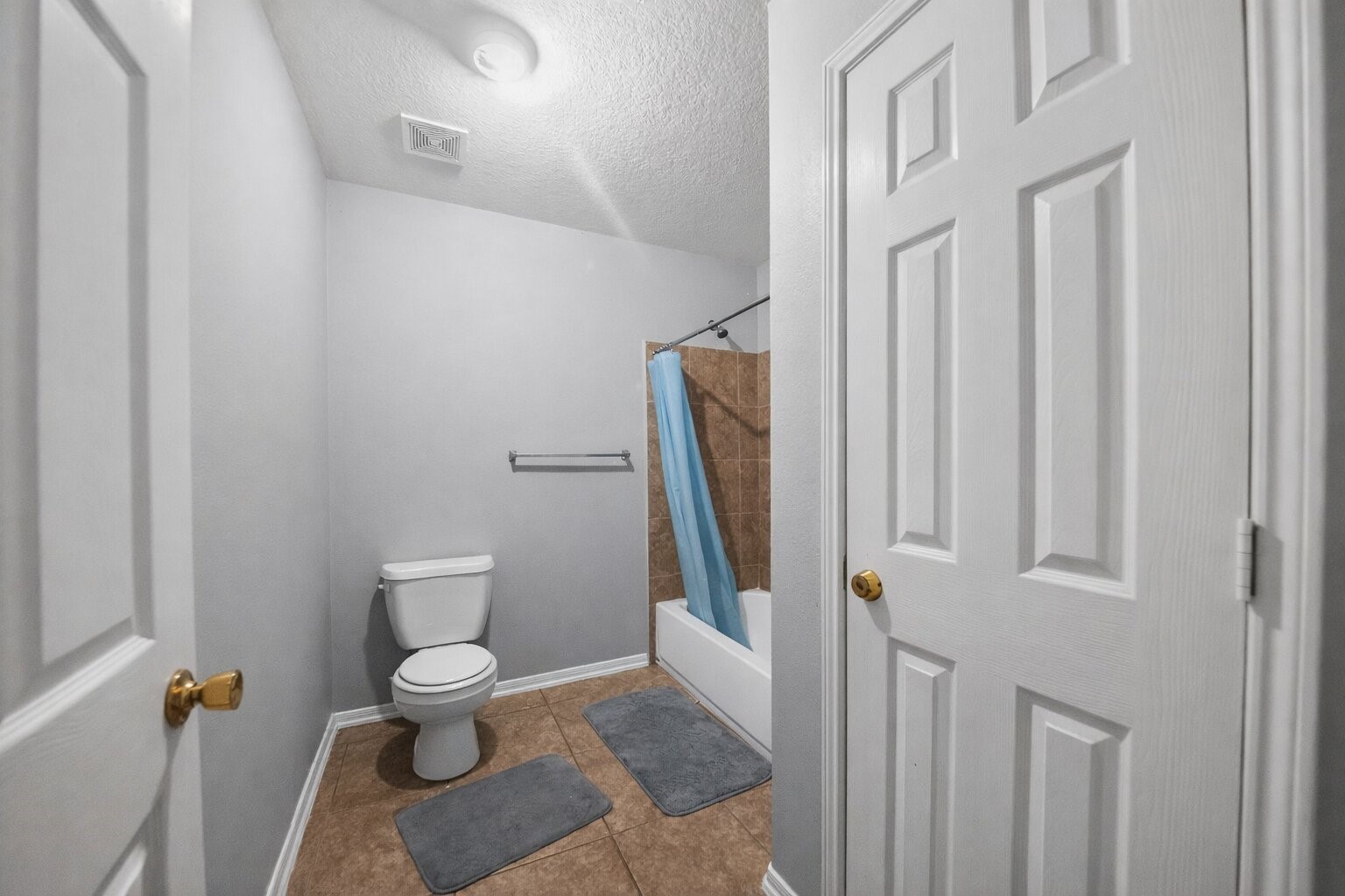 7902 Sesame Street Baytown, TX 77521 - Photo 14 of 24 a bathroom with a toilet and a shower