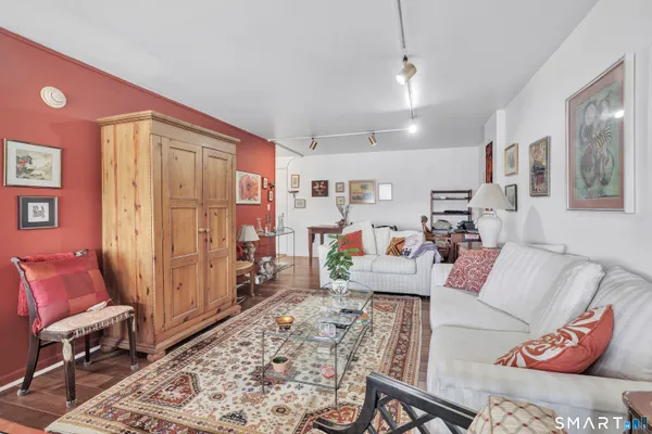 a living room with furniture and a rug
