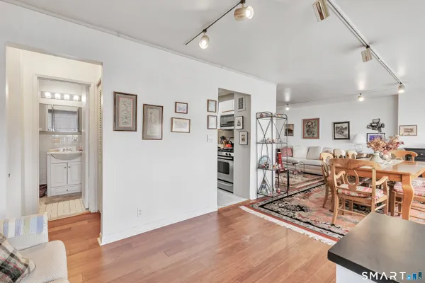 a view of a livingroom with furniture and wooden floor