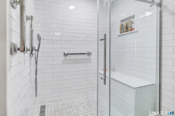 a bathroom with a shower and a shower