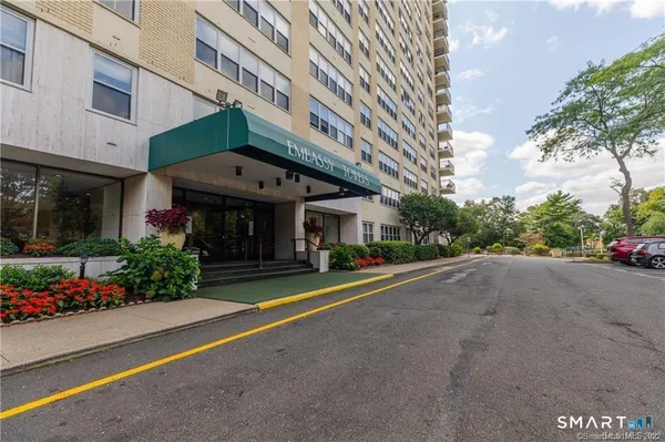 a view of a building with a yard