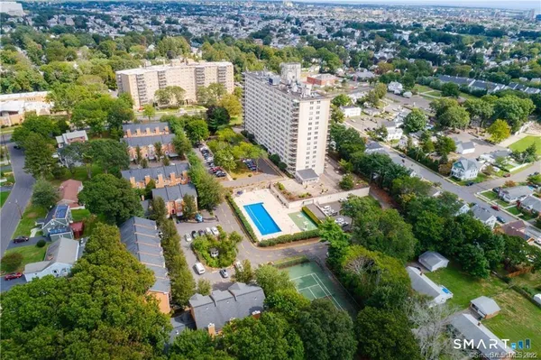 an aerial view of residential houses with outdoor space
