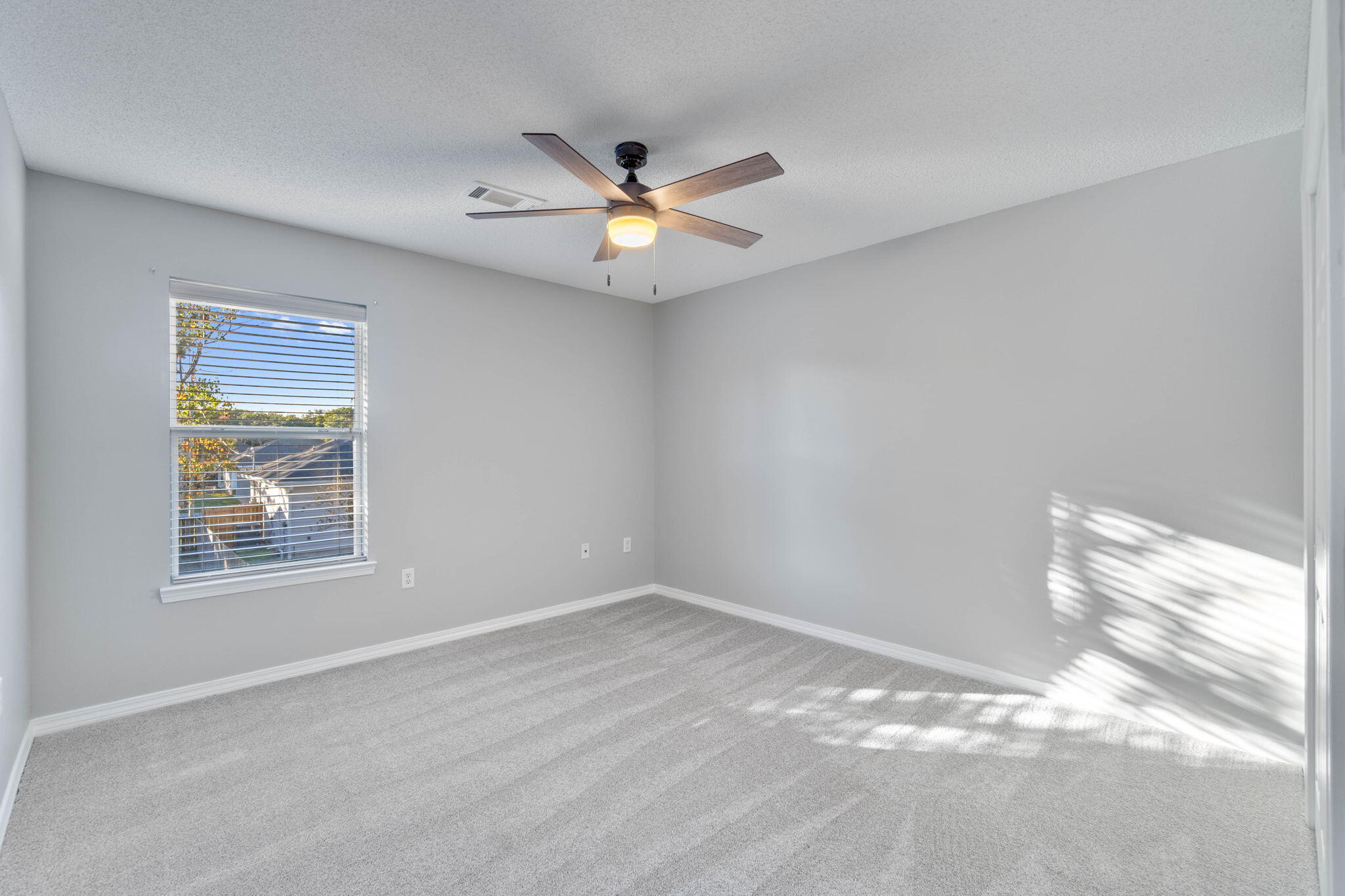 2145 Tom Street Navarre, FL 32566 - Photo 14 of 22 a view of an empty room with a window