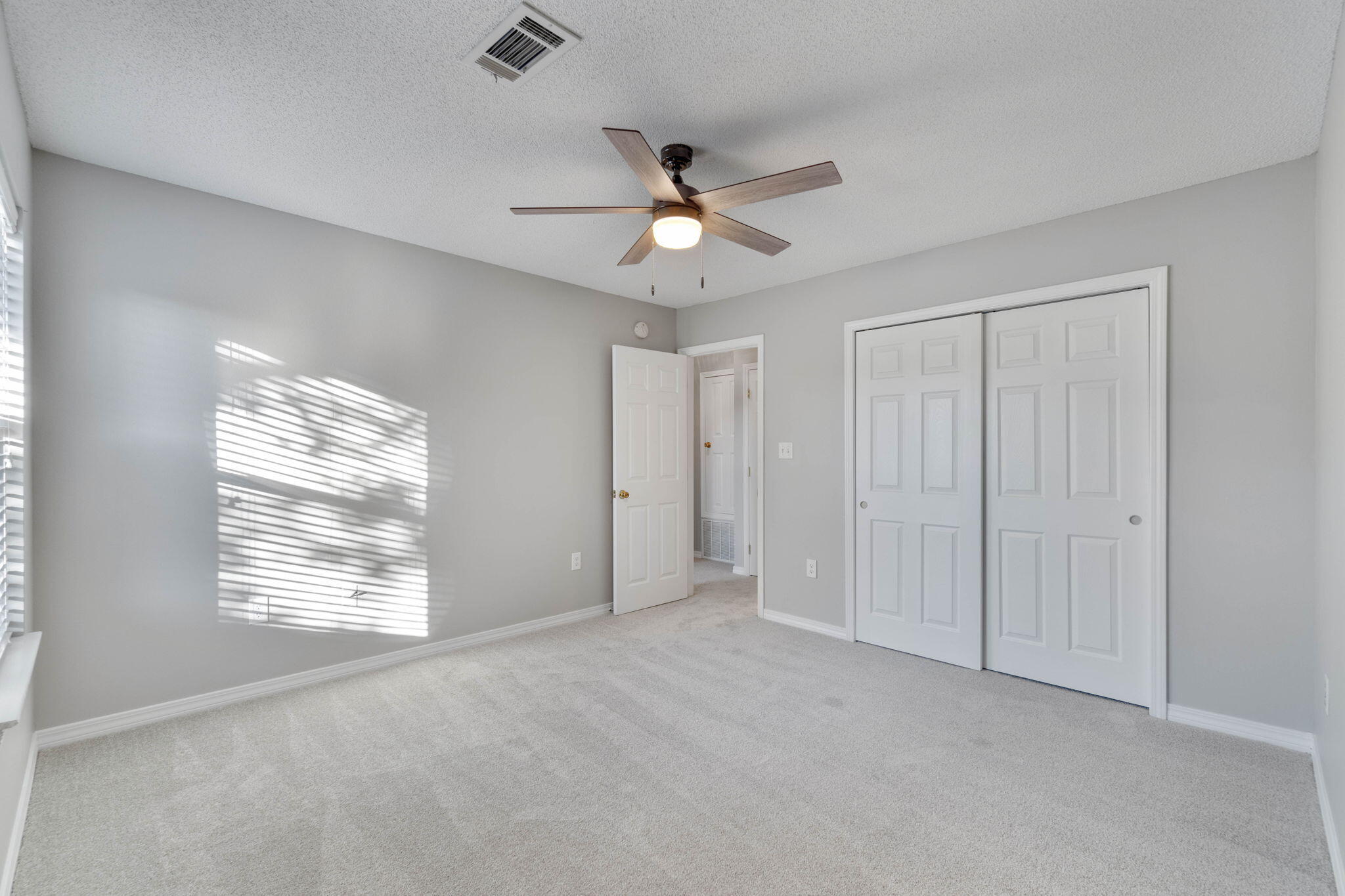2145 Tom Street Navarre, FL 32566 - Photo 17 of 22 a view of an empty room with a window