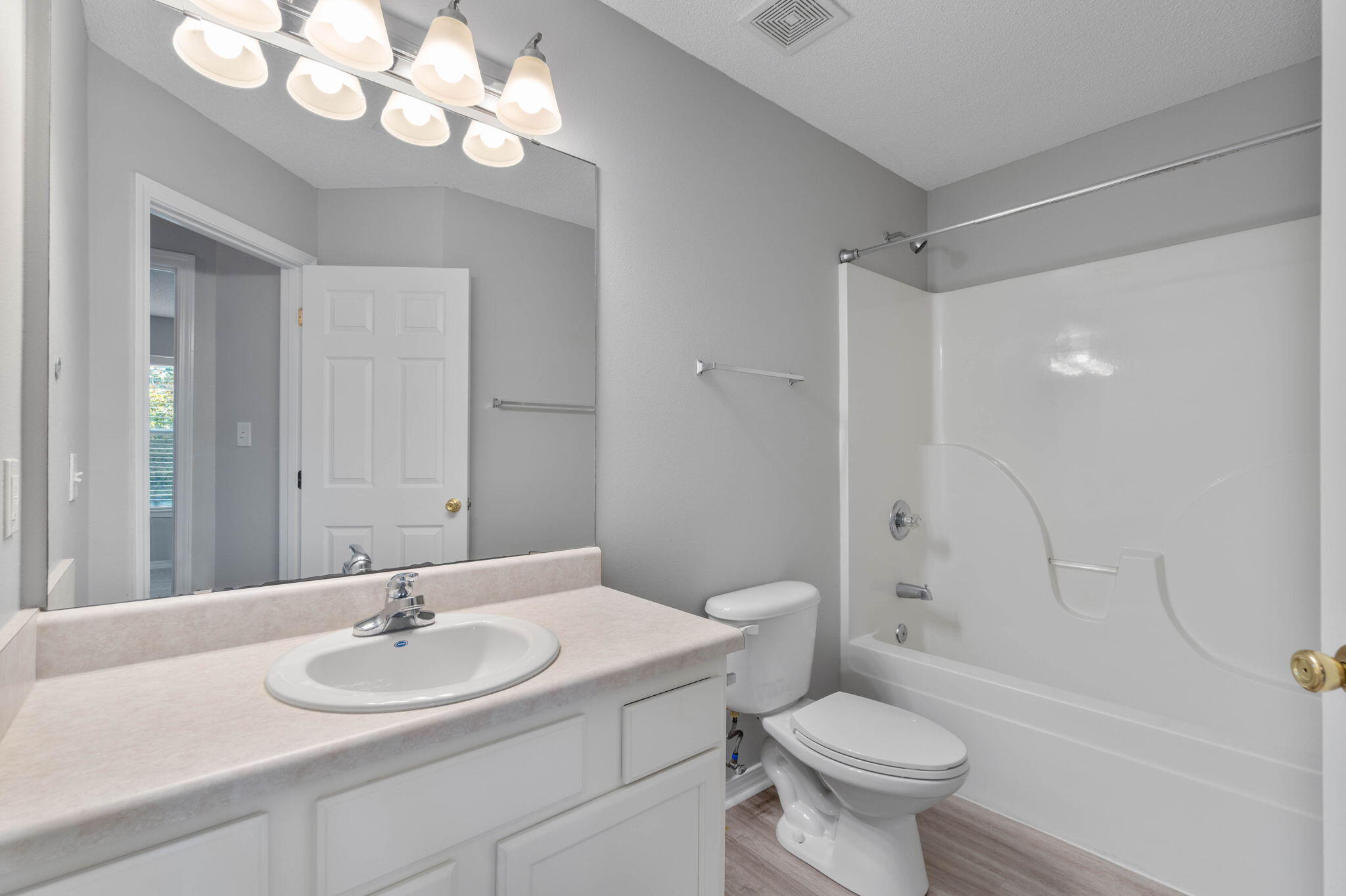 2145 Tom Street Navarre, FL 32566 - Photo 18 of 22 a bathroom with a sink toilet and shower