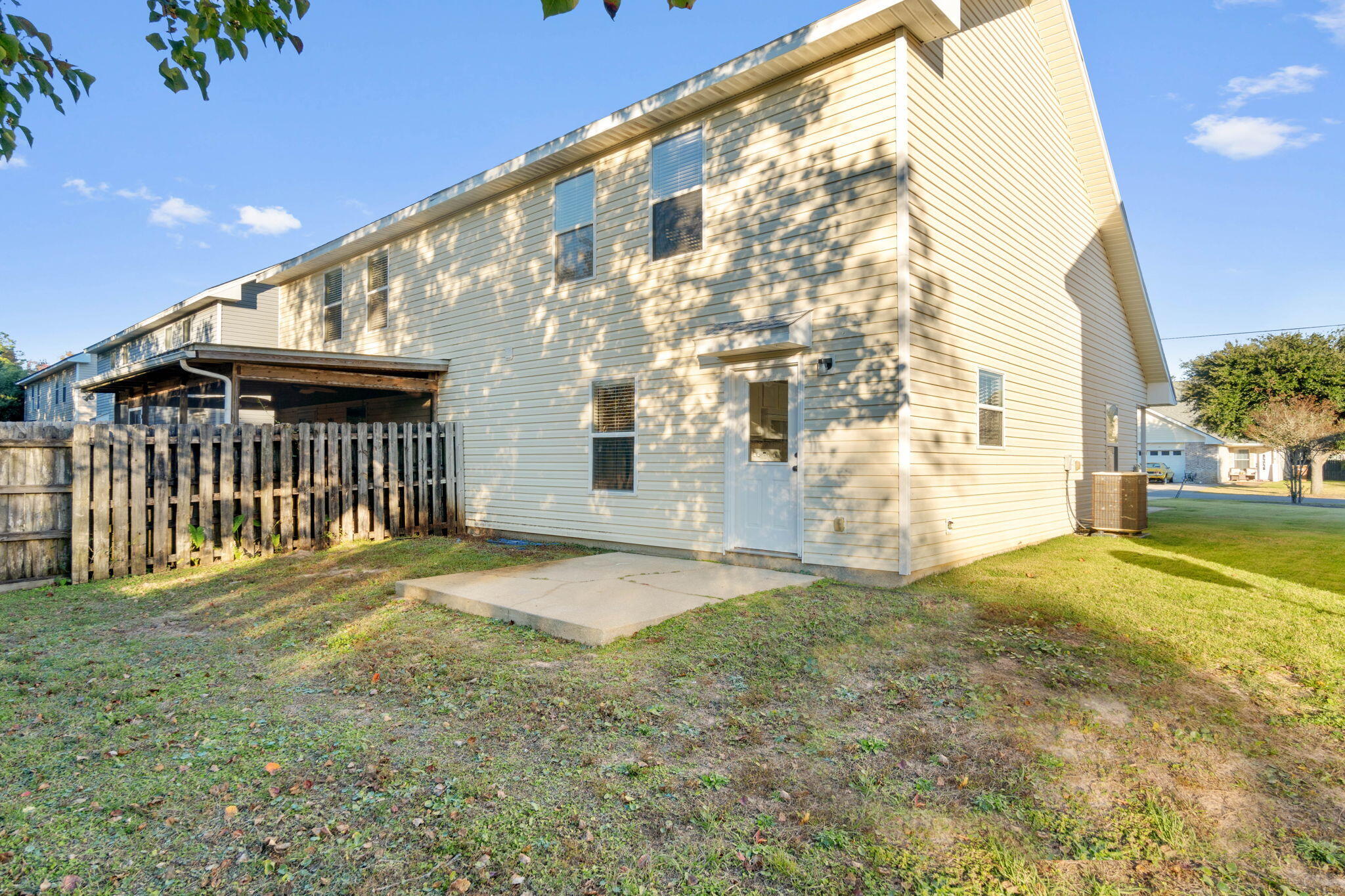 2145 Tom Street Navarre, FL 32566 - Photo 20 of 22 a view of a backyard with a garden