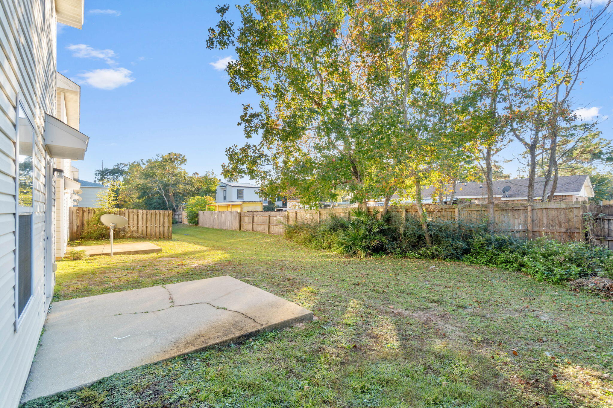 2145 Tom Street Navarre, FL 32566 - Photo 21 of 22 a view of a yard with palm trees