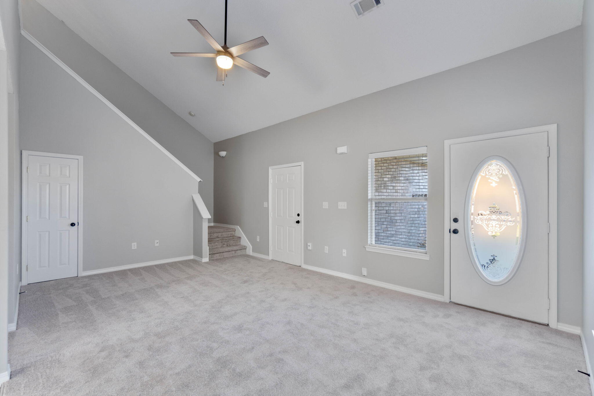 2145 Tom Street Navarre, FL 32566 - Photo 3 of 22 an empty room with windows and fan