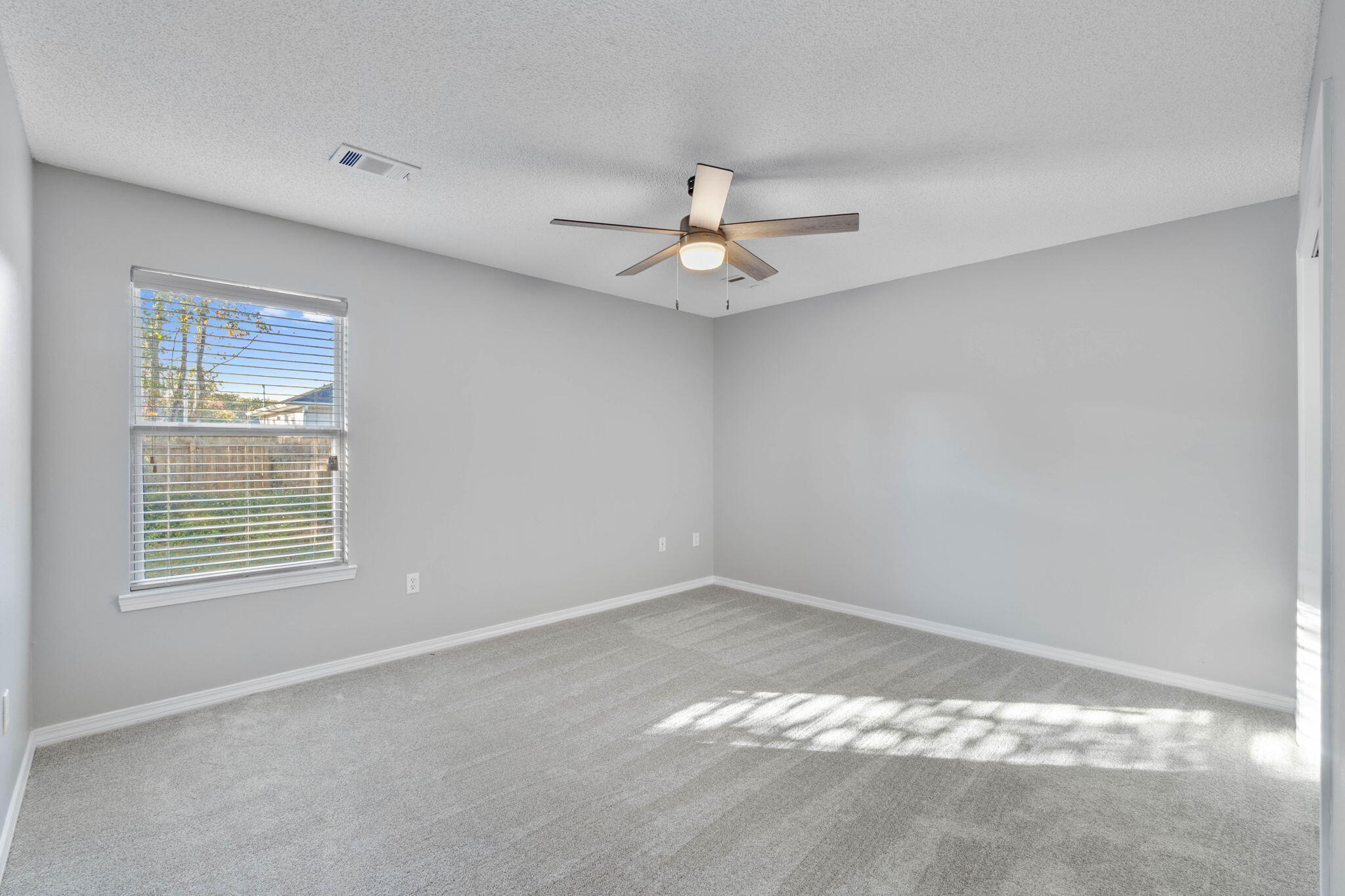 2145 Tom Street Navarre, FL 32566 - Photo 8 of 22 a view of a room that has a window in it