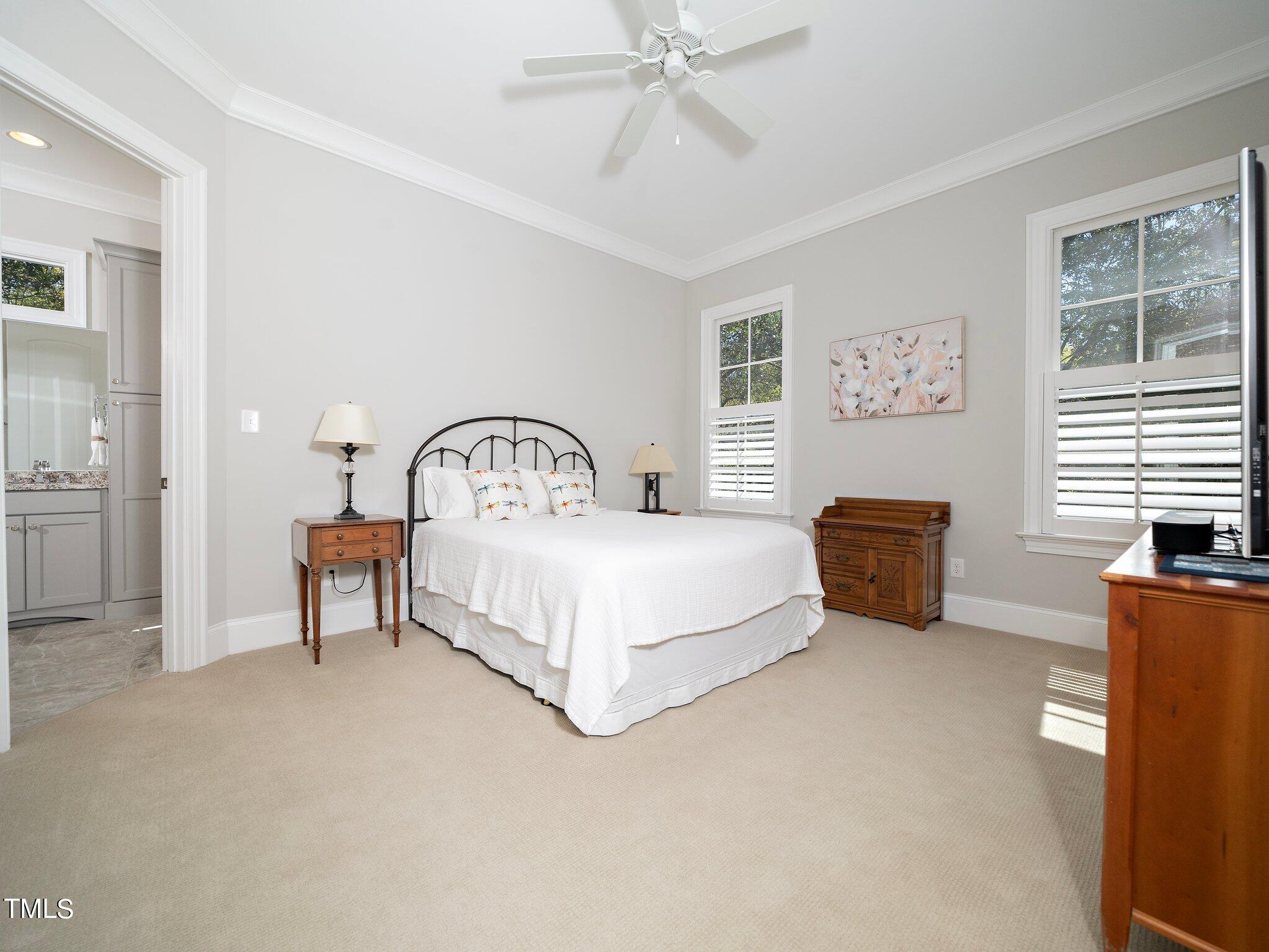 3311 Churchill Road Raleigh, NC 27607 - Photo 8 of 15 a bedroom with a bed a couch and a window