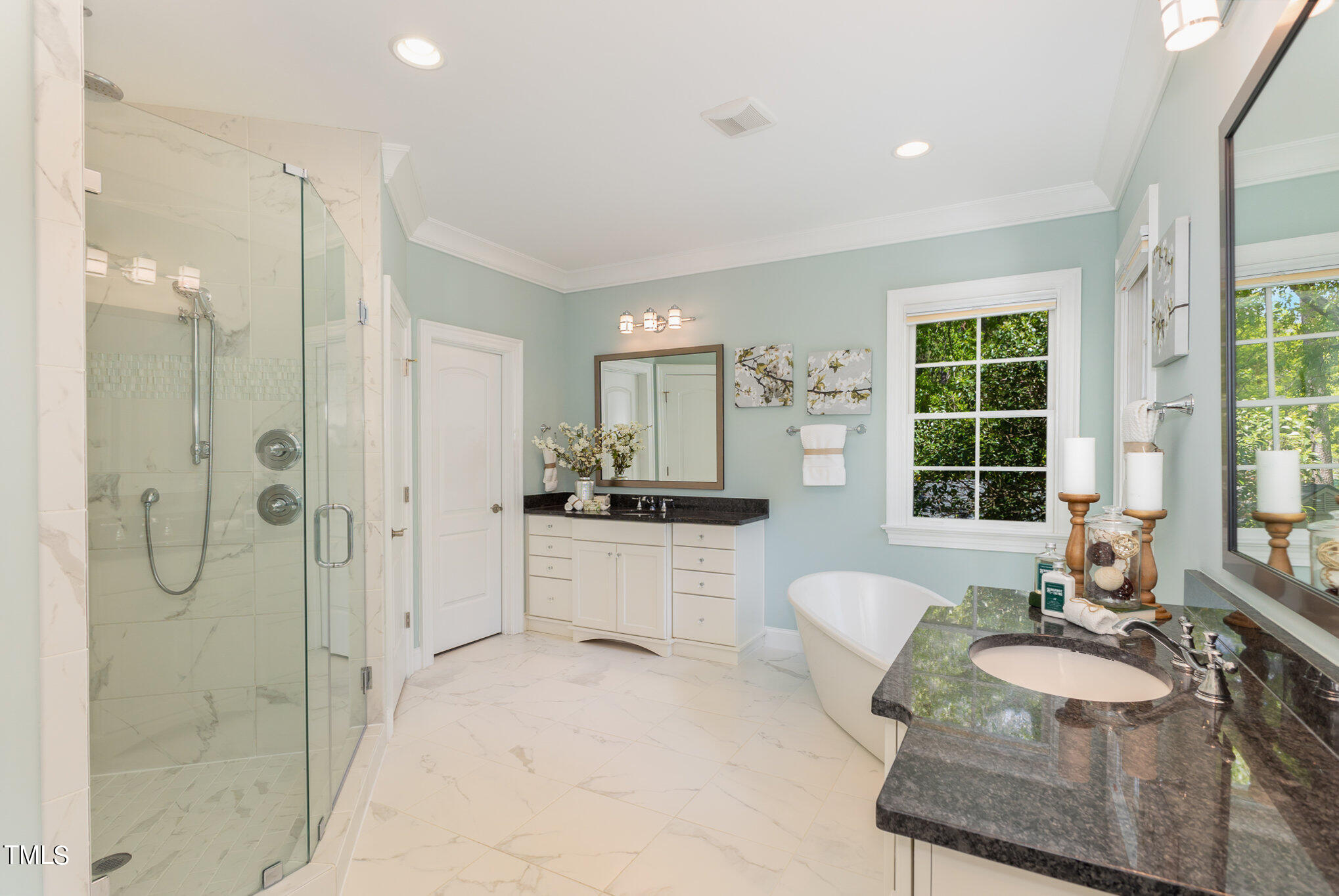 3311 Churchill Road Raleigh, NC 27607 - Photo 9 of 15 a large bathroom with a glass shower door and a sink
