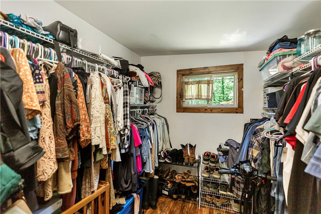 110 Lakeshore Lane Seneca, SC 29678 - Photo 16 of 50 This spacious primary walk-in closet provides ample storage and natural light for an organized wardrobe.
