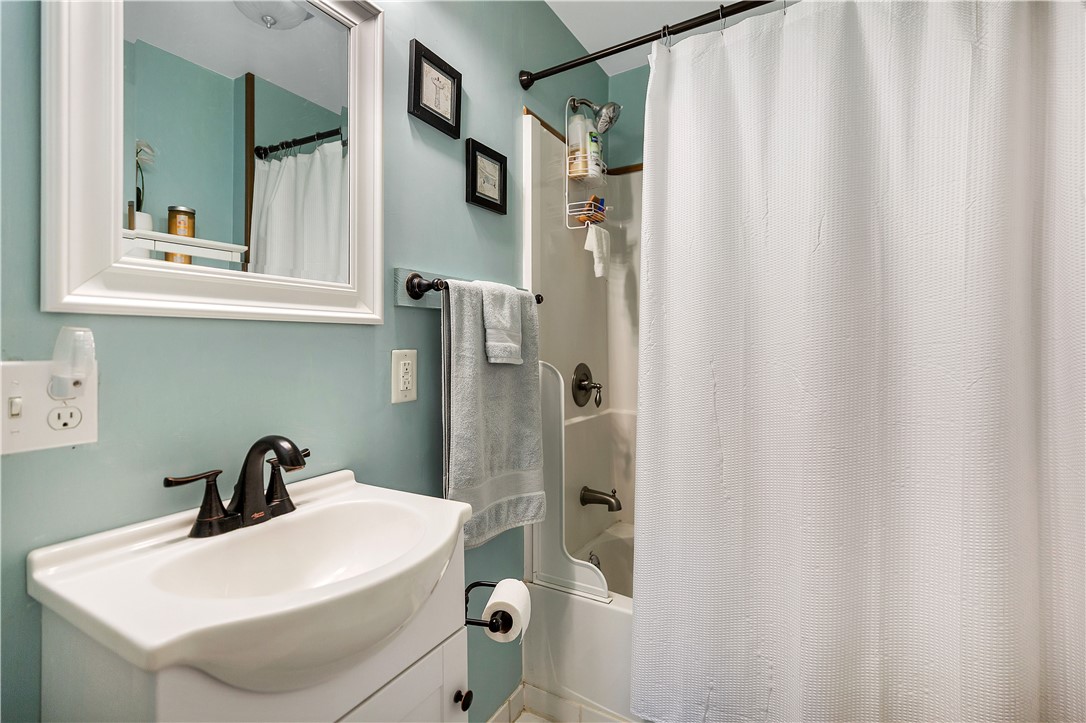 110 Lakeshore Lane Seneca, SC 29678 - Photo 20 of 50 This clean and bright main bathroom features a classic shower-over-bath design, offering comfort and style.