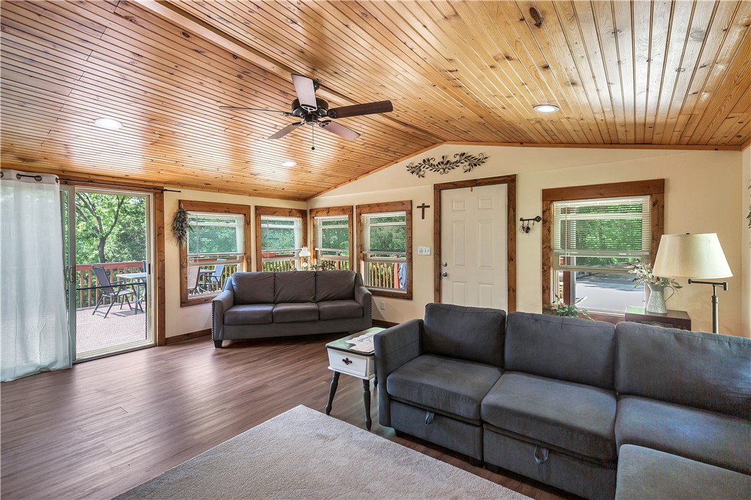 110 Lakeshore Lane Seneca, SC 29678 - Photo 4 of 50 This inviting living space features warm wood plank ceilings and ample natural light.