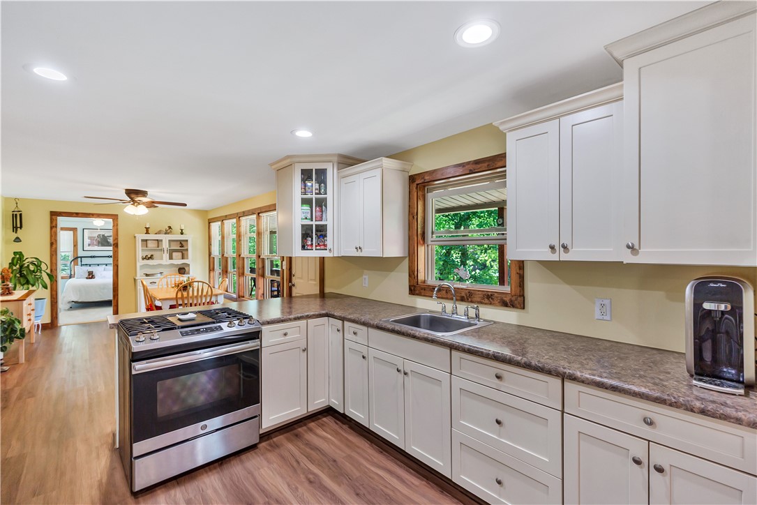 110 Lakeshore Lane Seneca, SC 29678 - Photo 8 of 50 This spacious kitchen offers a seamless flow into the adjacent dining and living areas.