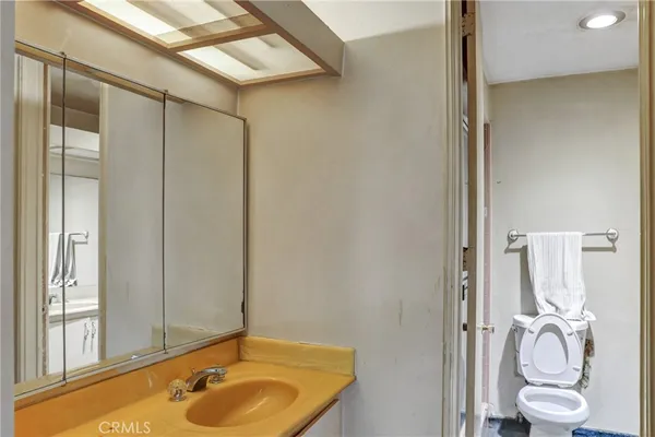 a living room with fireplace furniture and a large window