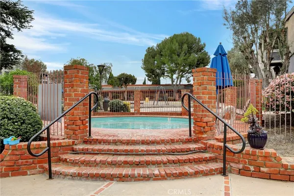 a view of a backyard with sitting area