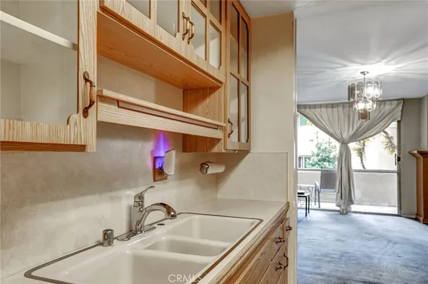 a kitchen with a sink and a window