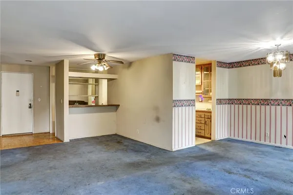 an empty room with a empty space and windows