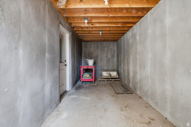 1232 Canyon Road Tooele, UT 84074 - Photo 45 of 54 Unfinished basement space featuring exposed wood joists and concrete walls
