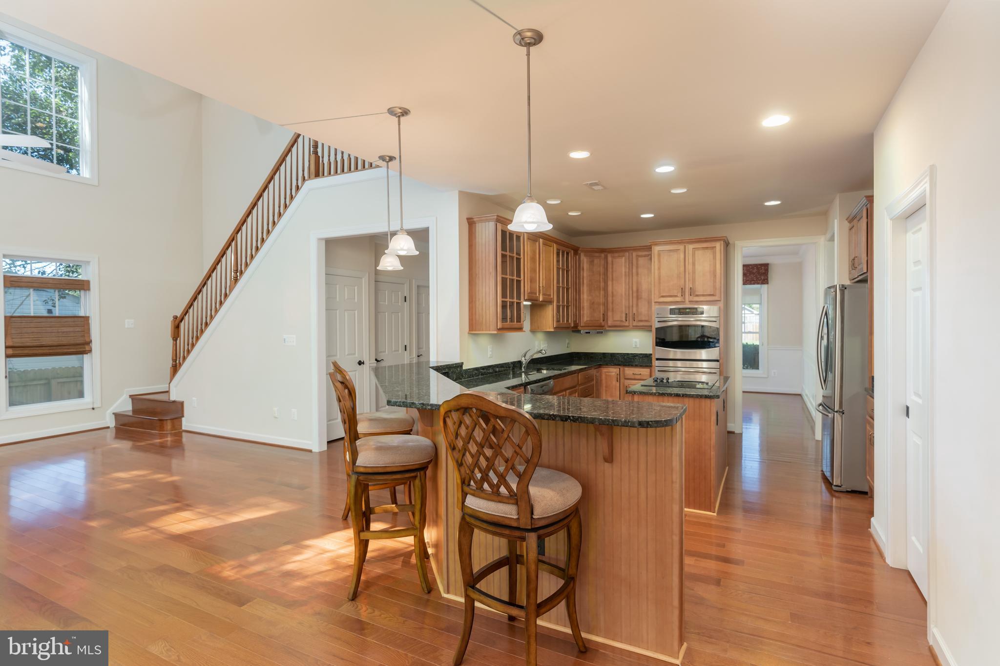 6303 Hanover Avenue Springfield, VA 22150 - Photo 17 of 29 Family room and kitchen.