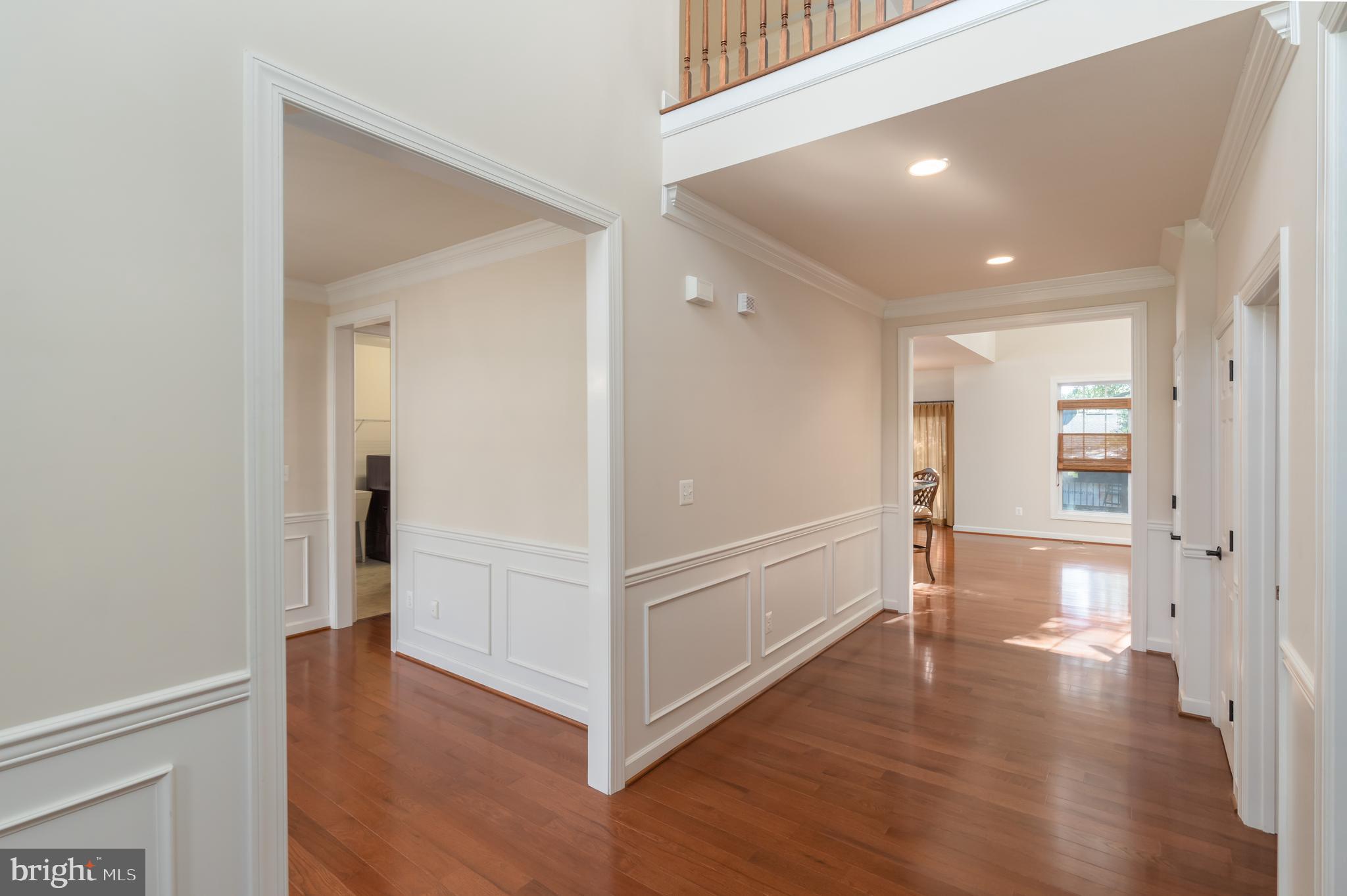 Foyer with 18 foot ceiling; hardwood floors.
