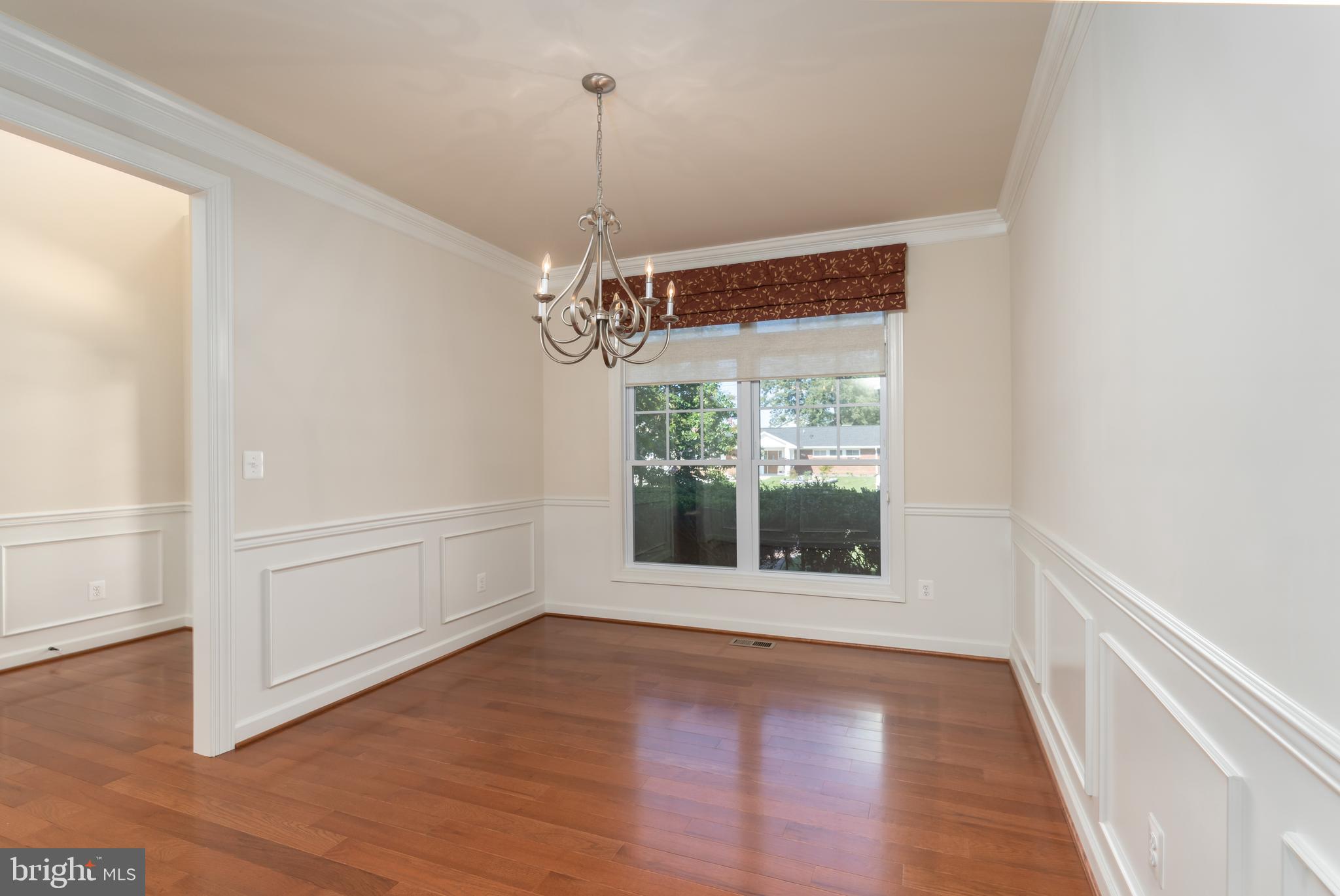 Formal dining room with elaborate millwork.