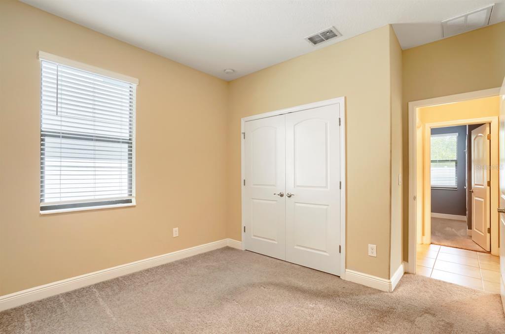 12690 Vander Way New Port Richey, FL 34654 - Photo 18 of 22 a view of an empty room with closet and a window