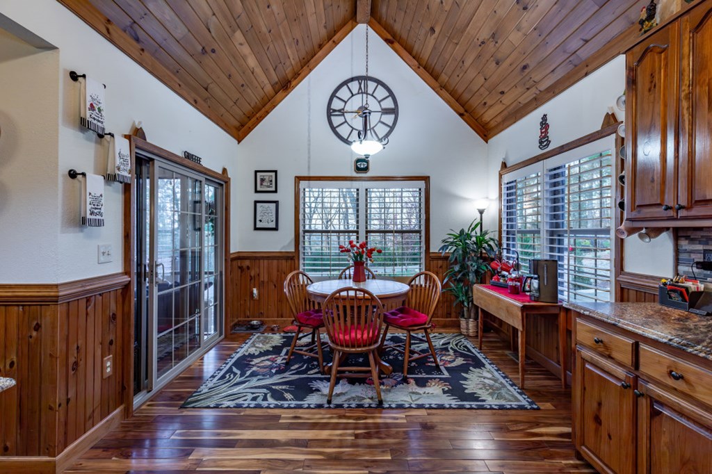 159 Apple Blossom Road Blairsville, GA 30512 - Photo 14 of 56 a dining room with furniture a rug potted plants and wooden floor