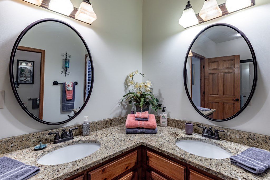 159 Apple Blossom Road Blairsville, GA 30512 - Photo 20 of 56 a bathroom with a granite countertop double vanity mirror and a mirror