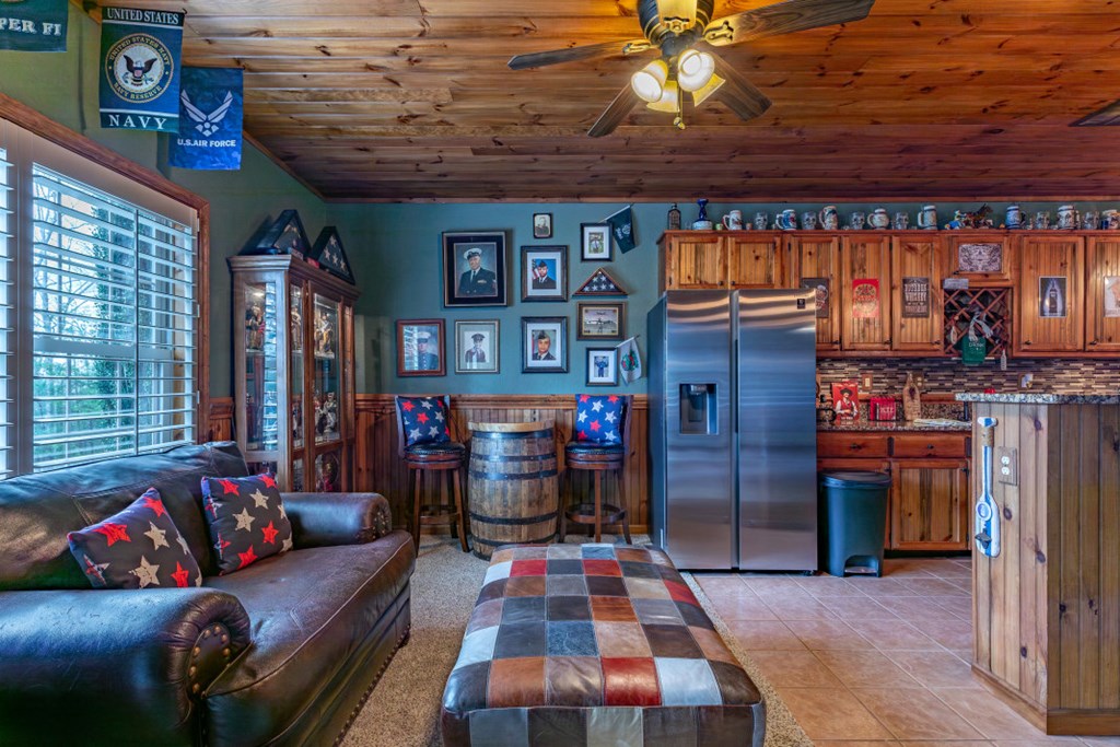 159 Apple Blossom Road Blairsville, GA 30512 - Photo 29 of 56 a living room with furniture a flat screen tv and a fireplace