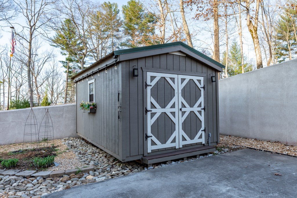 159 Apple Blossom Road Blairsville, GA 30512 - Photo 40 of 56 a wooden door covered with wooden fence and plants