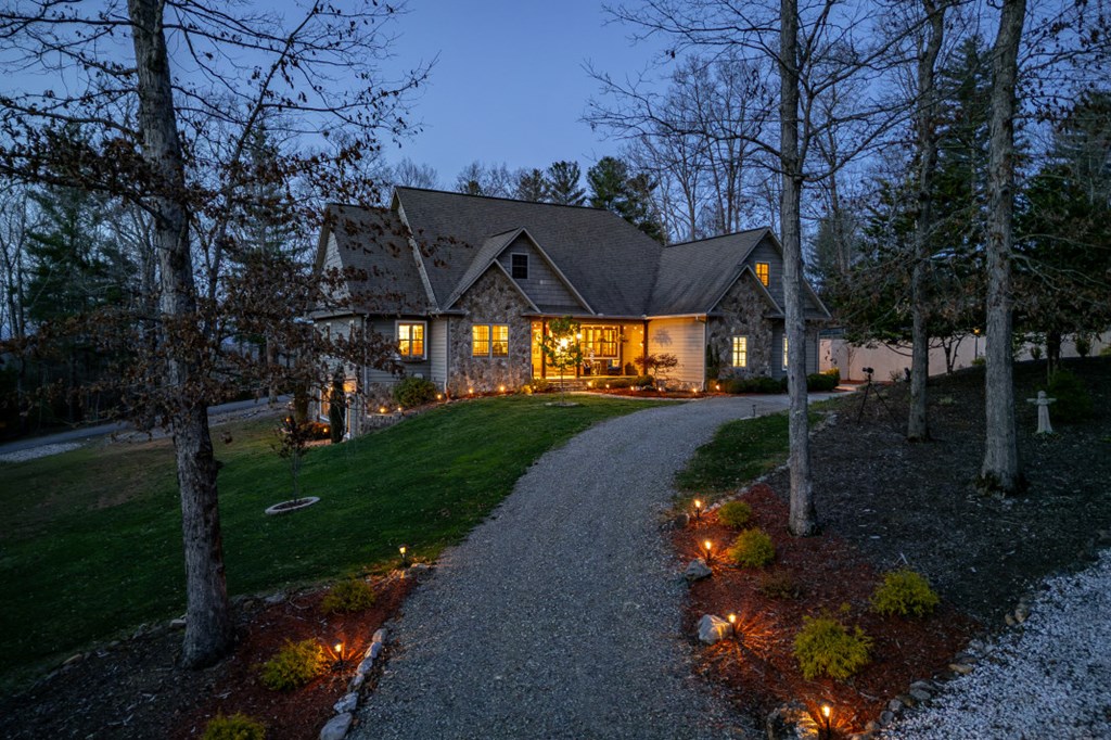 159 Apple Blossom Road Blairsville, GA 30512 - Photo 49 of 56 a view of a street with a bench and trees