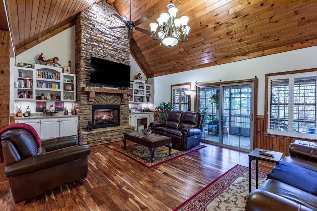 159 Apple Blossom Road Blairsville, GA 30512 - Photo 10 of 56 a living room with furniture a flat screen tv and a fireplace