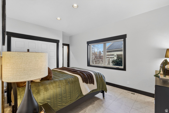 145 Carnesecca Court Mapleton, UT 84664 - Photo 15 of 109 Bedroom featuring a closet, recessed lighting, and light marble finish floors