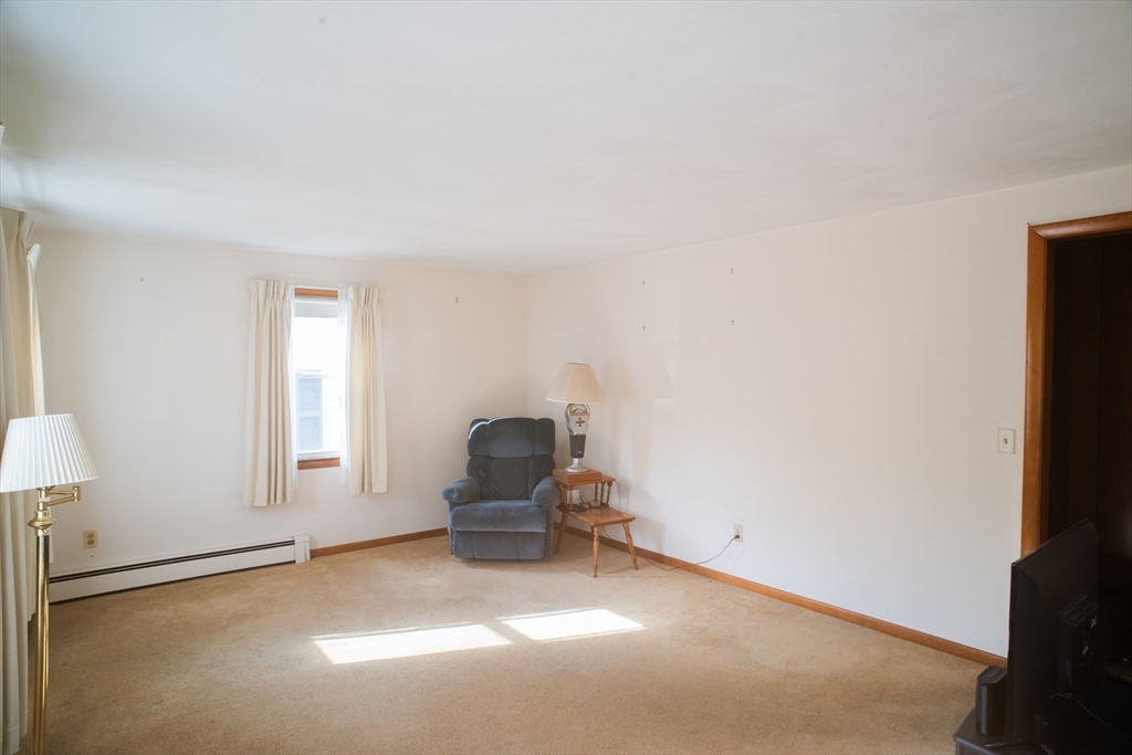 94 David Street Springfield, MA 01104 - Photo 5 of 11 a living room with furniture and a window