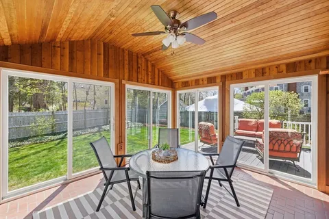 a view of a dining room with furniture window and outside view