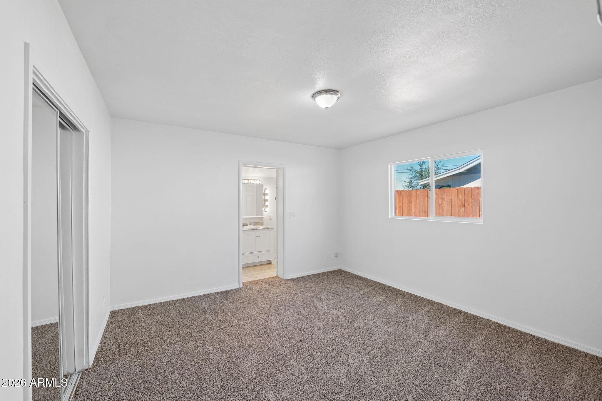 7 South Catalina Street Gilbert, AZ 85233 - Photo 17 of 34 a view of an empty room with a window