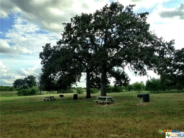 a view of a park with welcome board