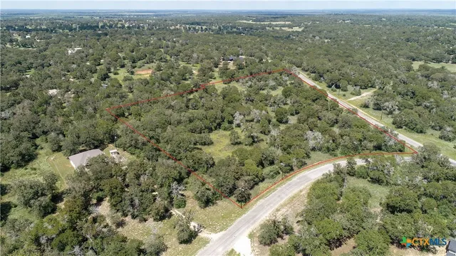 an aerial view of mountain with trees