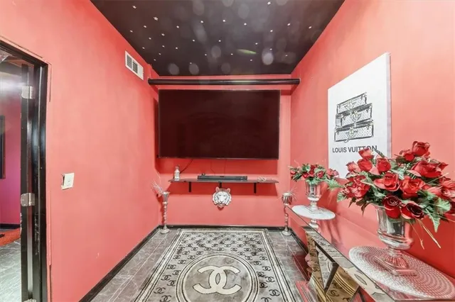 a balcony with wooden floor and trees