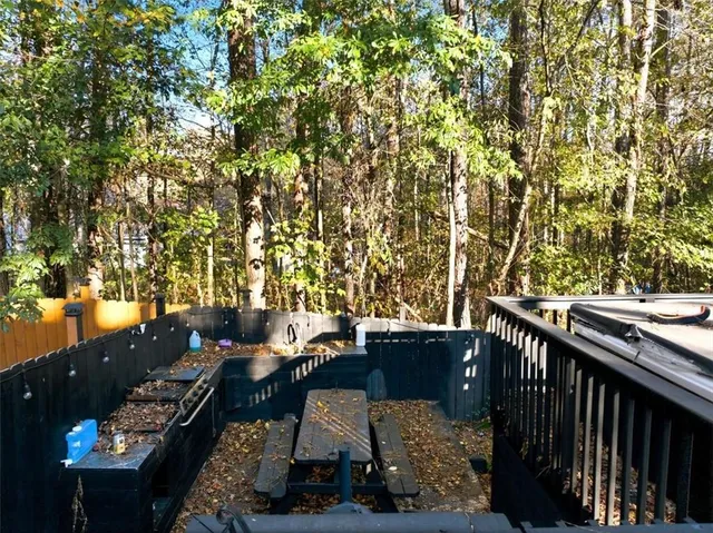 a view of a chair and table in the balcony