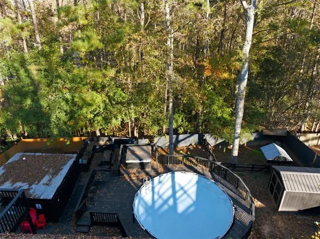 a view of a house with a yard and sitting area